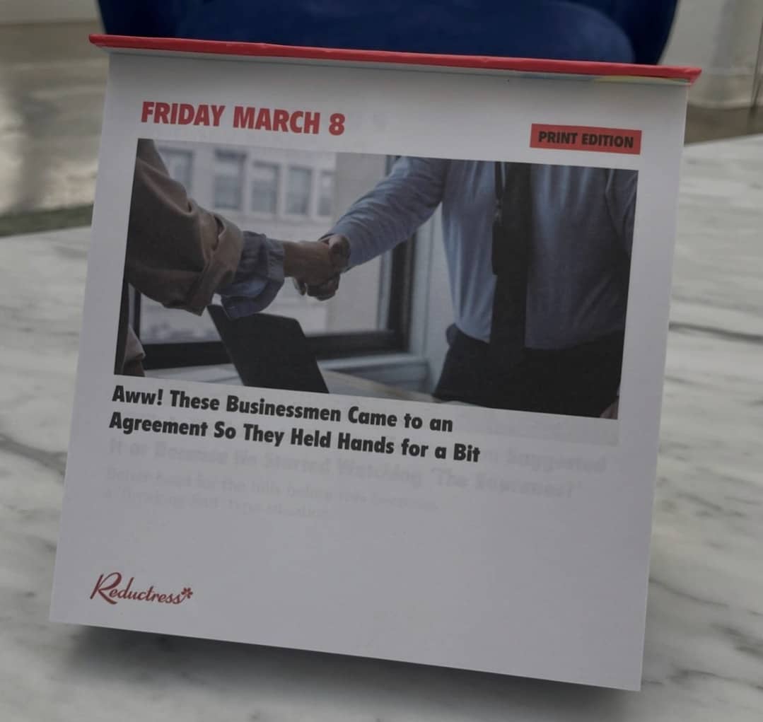 Reductress calendar meme about businessmen holding hands for a bit after reaching an agreement.