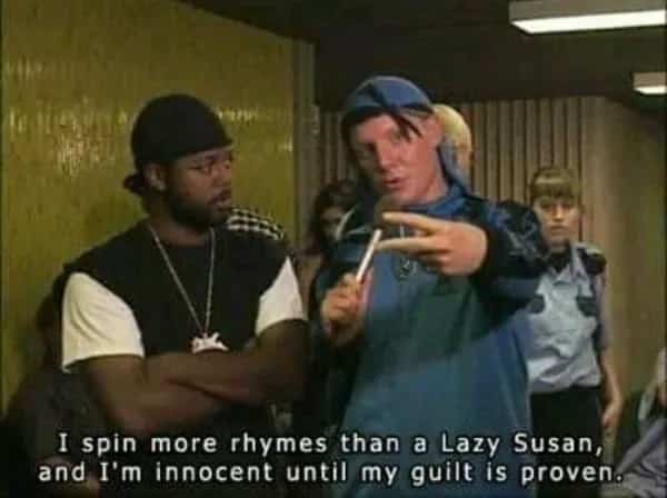 Character J-Roc from Trailer Park Boys rapping in a blue tracksuit with humorous rap subtitles.