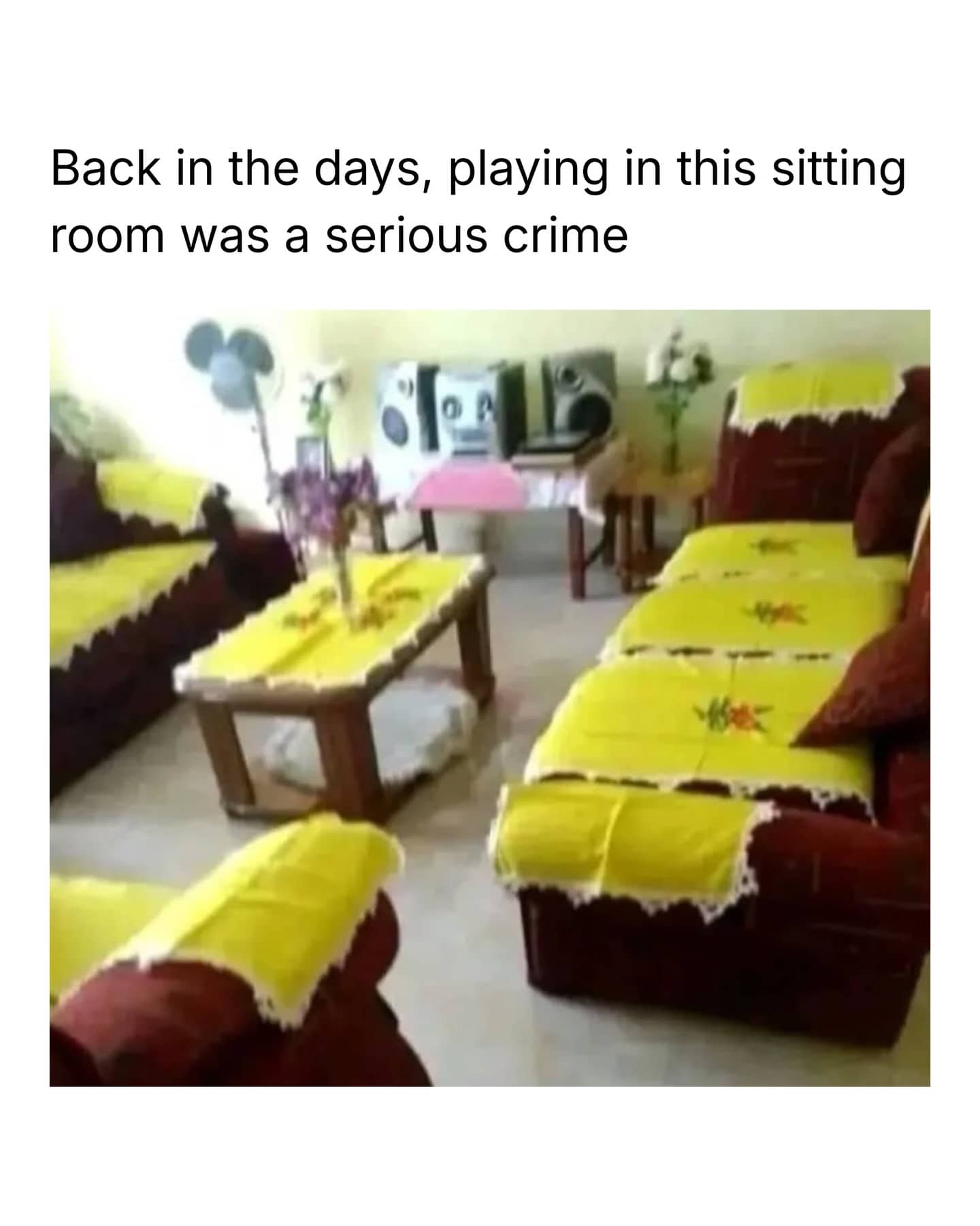 Retro living room with couches and tables covered in yellow lace cloths and funny caption.