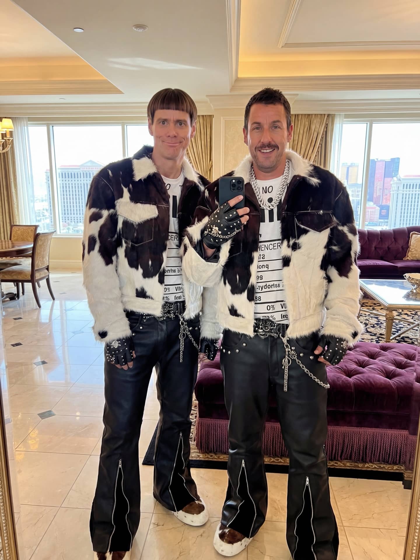 Men dressed as Jim Carrey and Adam Sandler characters wearing matching cow print jackets.