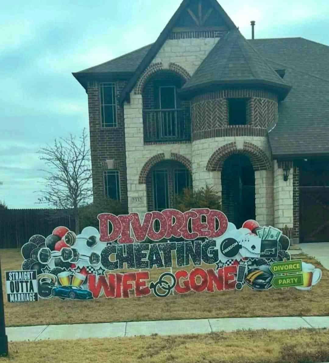 suburban lawn is overtaken by an elaborate, glittery yard display celebrating a messy breakup with the loud message: "DIVORCED CHEATING WIFE GONE!".