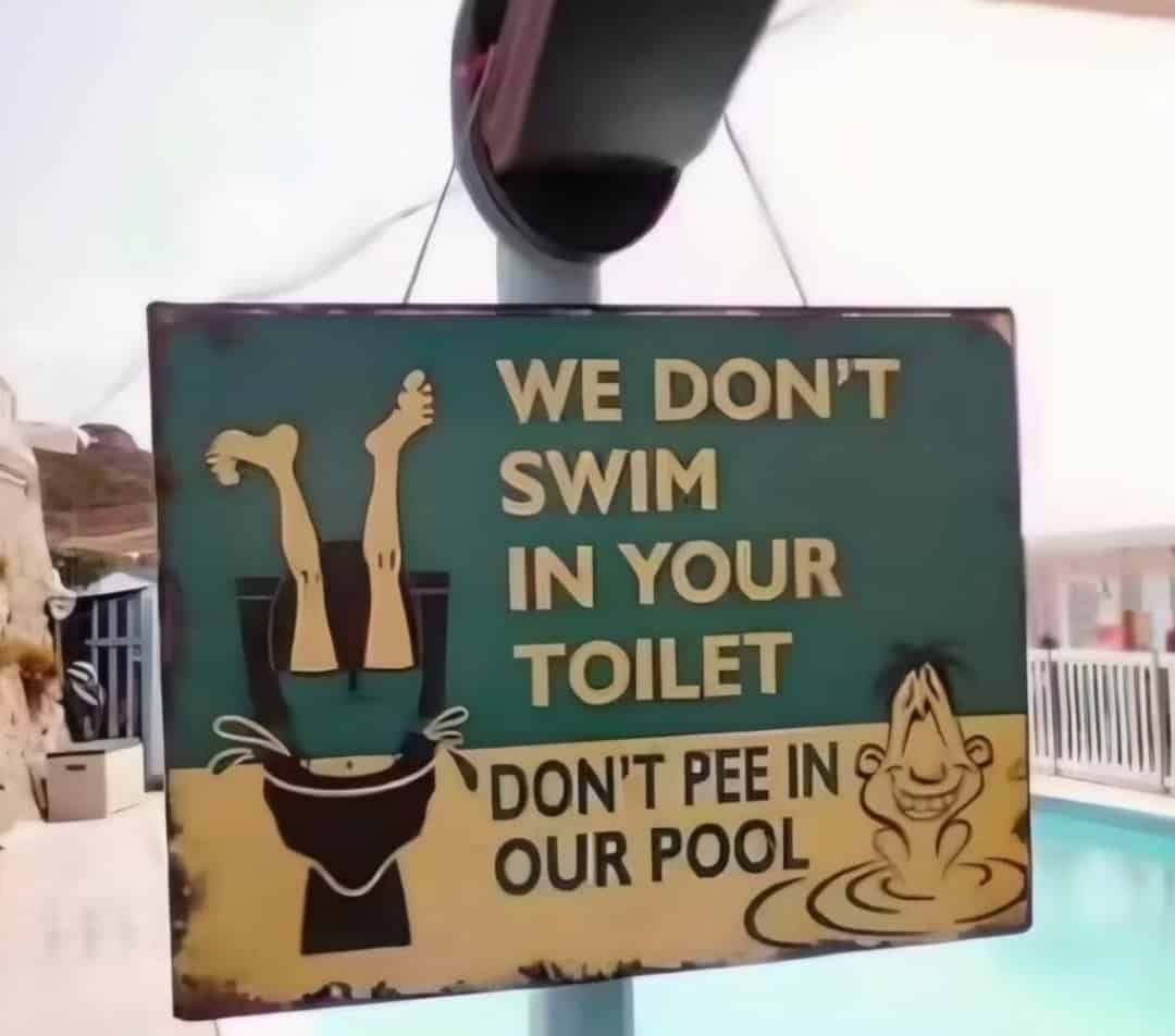 A classic swimming pool sign uses a blunt visual of someone head-first in a toilet to demand that guests refrain from peeing in the pool.