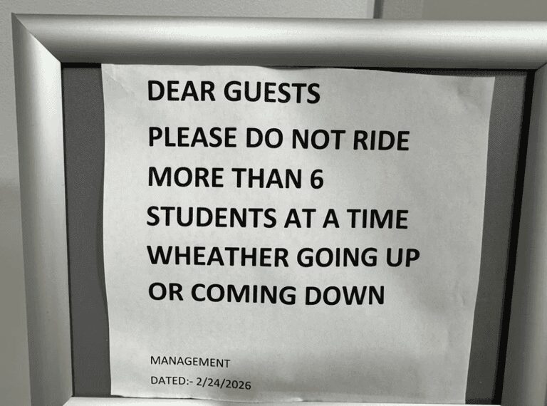 bizarrely phrased funny sign from management dated February 24, 2026. It instructs guests, "PLEASE DO NOT RIDE MORE THAN 6 STUDENTS AT A TIME," likely a hilarious mistranslation or typo meant to limit the capacity of an elevator or shuttle bus.