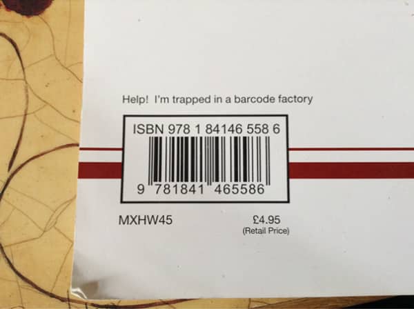 Book barcode area with a hidden joke message saying help I am trapped in a factory.