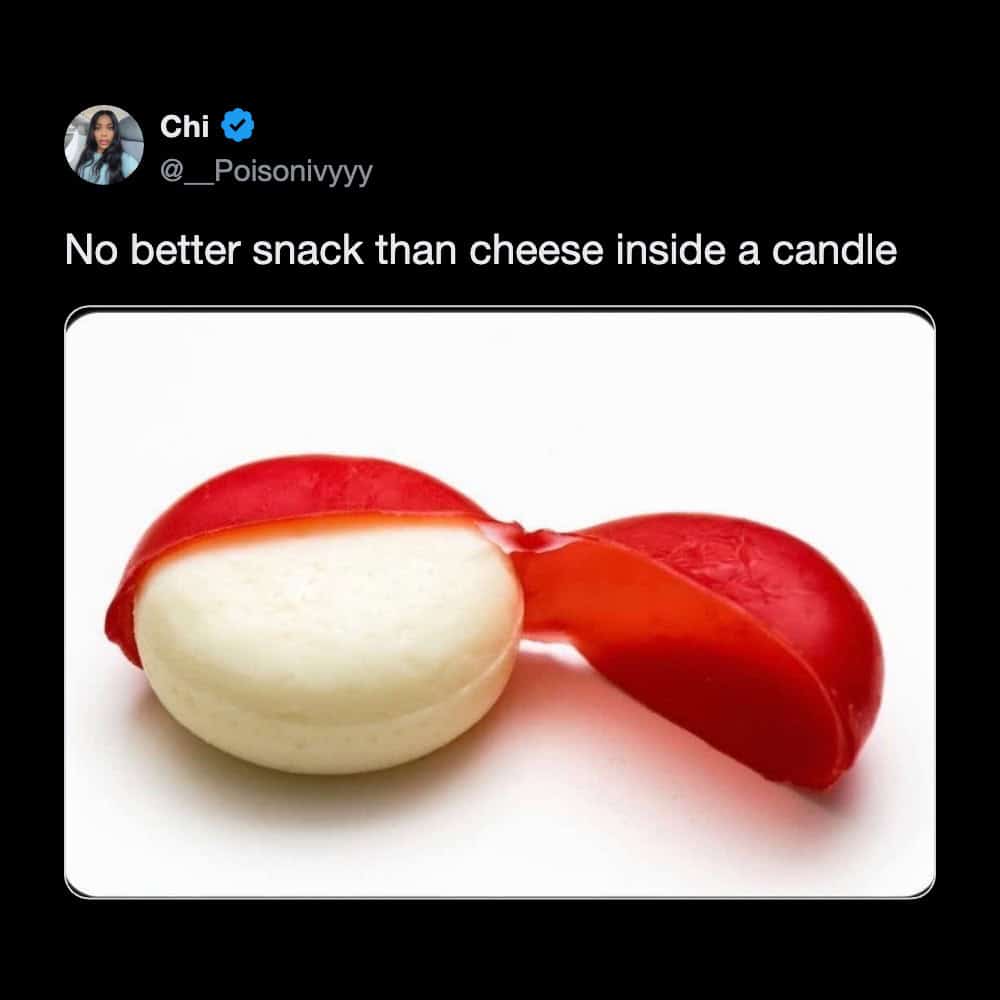 A highly accurate funny tweet showing a classic red wax-wrapped Babybel cheese wheel with a caption declaring there is no better snack than cheese inside a candle, marking it as one of the funniest tweets about childhood snacks.