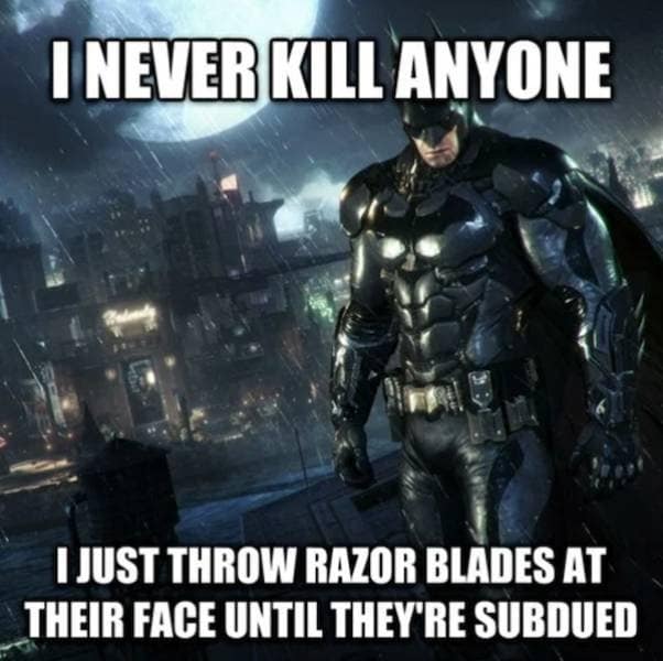 Batman stands stoically in a rainy Gotham City in this satirical video game meme, highlighting the unhinged logic of his "non-lethal" combat where he repeatedly throws razor-sharp Batarangs at criminals' faces until they are "subdued."