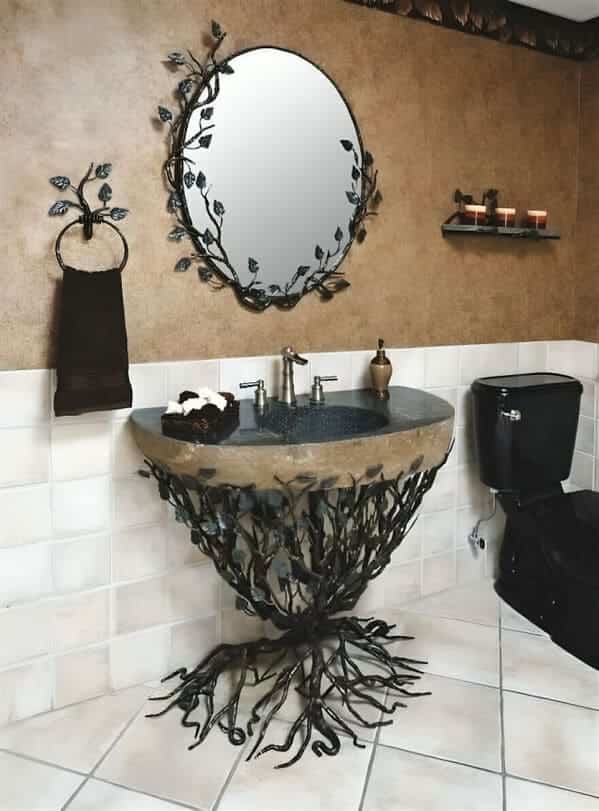 A bathroom vanity featuring a base made of intricate, tangled metal branches that reach the floor.