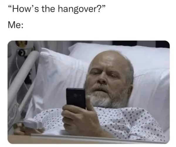 Waking up after a night out feels like a literal medical emergency in this hangover meme, featuring a weary man in a hospital bed checking his phone for regrettable texts.