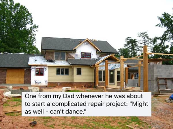 House currently under construction on a dirt lot with a "might as well - can't dance" text overlay.