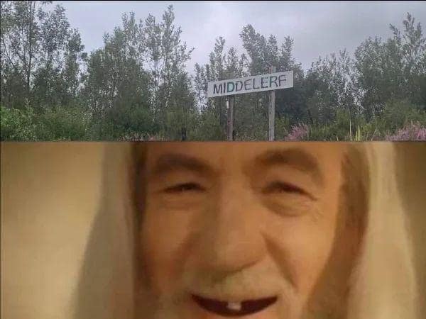 surreal and distorted lotr meme pairing a blurry road sign for "MIDDELERF" with a low-resolution, toothless, and manically laughing Gandalf the White.