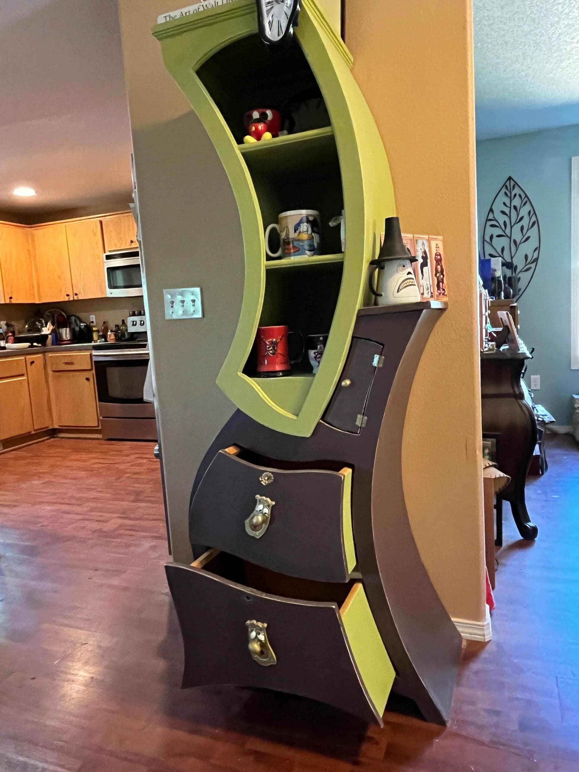 A whimsical, warped bookshelf and dresser combo from this meme dump that looks like it was plucked straight from a cartoon or a fever dream, featuring lime green and dark purple accents with drawers that curve at impossible angles.