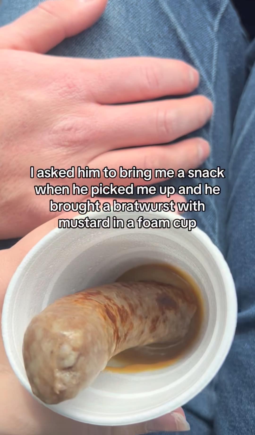 chaotic funny meme capturing a "car snack" disaster where a boyfriend brought a single bratwurst submerged in a foam cup of mustard after being asked for a snack