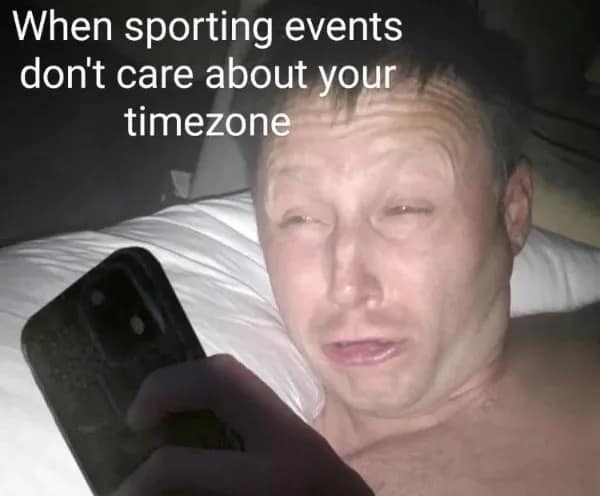 Limmy waking up looking completely disoriented and exhausted while checking a smartphone in bed. Relatable funny memes about watching international sporting events in terrible time zones.