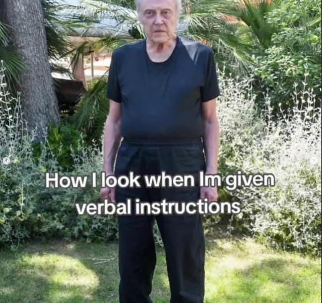 Christopher Walken's blank, focused stare in a garden provides the perfect visual for this internet meme about the internal mental strain of trying to process complex verbal instructions.