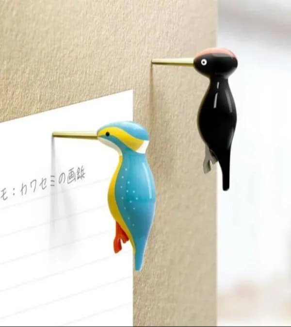 Creative office push pins designed to look like tiny woodpeckers and kingfishers pecking directly into a corkboard. Cool product designs featured in this meme dump.