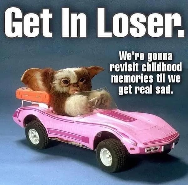 Gizmo from Gremlins looks determined in a pink toy convertible in this funny meme about going on a nostalgia trip specifically designed to trigger deep, childhood-related emotional sadness.