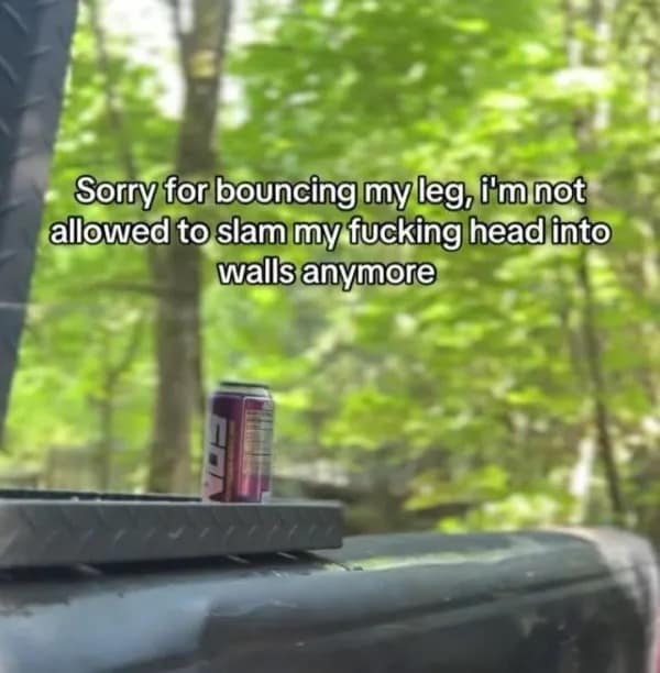 A chaotic text overlay on a blurry outdoor background explains that a person's constant leg bouncing is simply a safer alternative to slamming their head into a wall in this relatable hilarious meme.