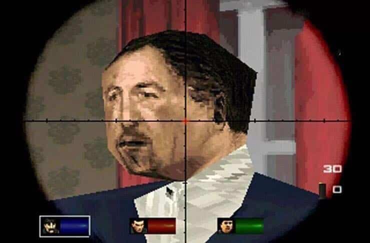 A pixelated character in a vintage video game targeted by a sniper scope looking like Sandler.