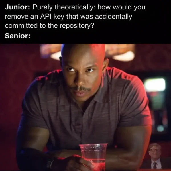 high-stress programmer meme using an intense close-up of James Doakes from Dexter. The caption describes a Junior developer "theoretically" asking how to remove an API key committed to a repository, while the Senior developer stares back in silent judgment.