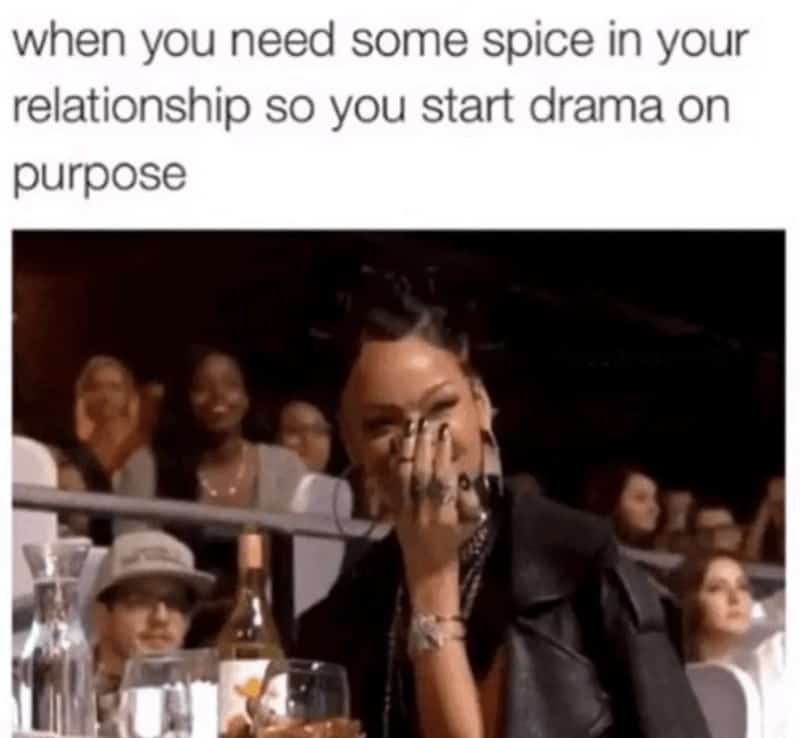 chaotic relationship meme showing a blurry image of Rihanna laughing and covering her face with her hand. The text above suggests a toxic but funny tactic: "when you need some spice in your relationship so you start drama on purpose."