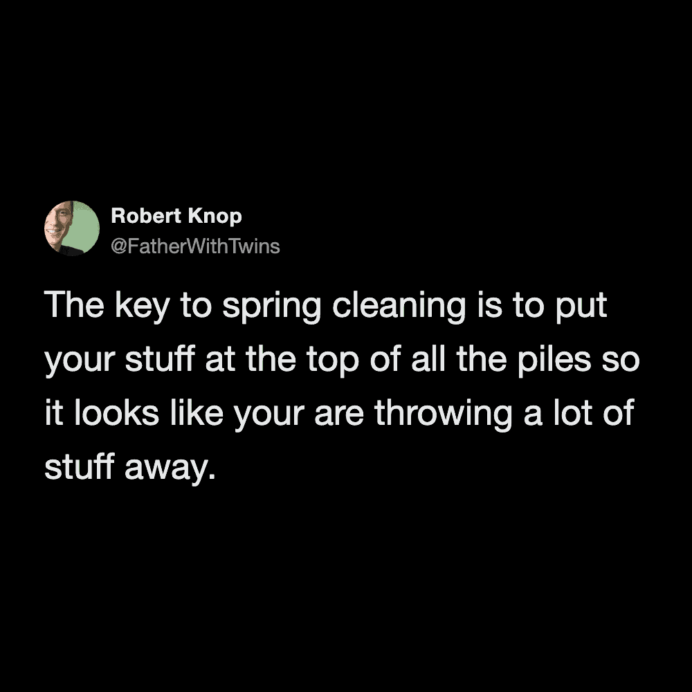 A cynical spring cleaning meme from @FatherWithTwins about faking progress. The text suggests putting your own stuff on top of piles "so it looks like you are throwing a lot of stuff away."