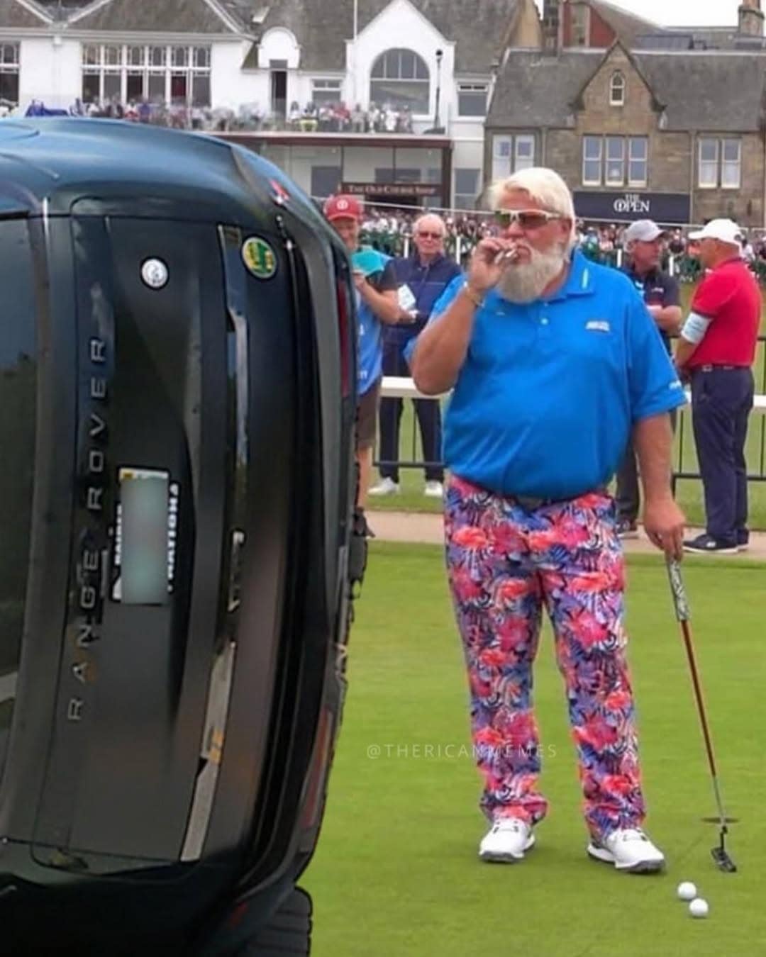 A chaotic Tiger Woods crash meme showing professional golfer John Daly in vibrant floral pants smoking a cigarette on a green, with Tiger's overturned black Range Rover photoshopped into the foreground next to him.