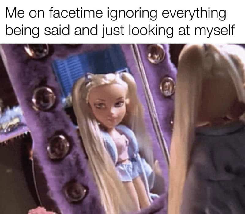 A Bratz doll staring obsessively at her own reflection in a fuzzy purple mirror in a women meme exposing the reality of just looking at yourself during FaceTime calls, a classic in memes for women.