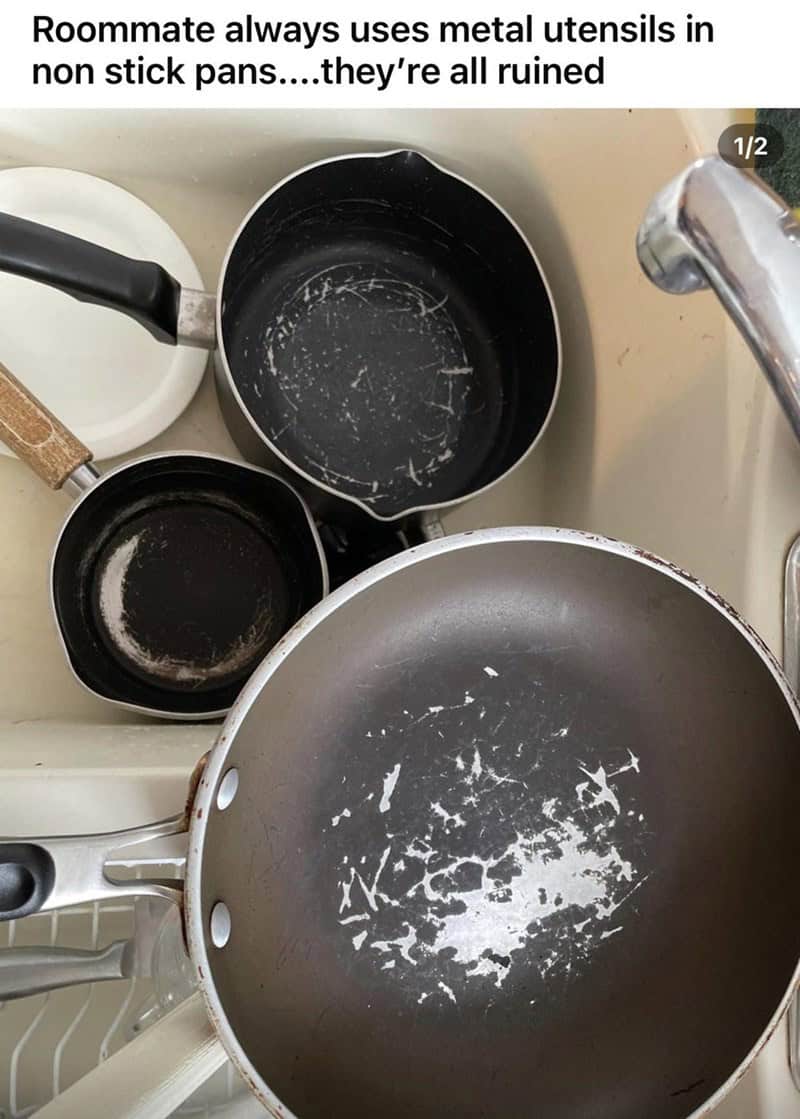 Expensive property damage from one of the worst roommates. A sink contains several non-stick pots and a large frying pan that have been completely ruined with deep silver gouges after someone repeatedly used metal utensils on the delicate coating.