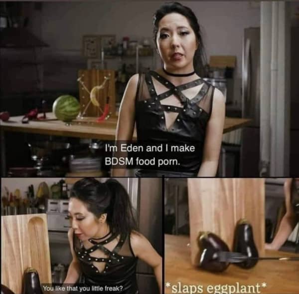 Woman in black harness outfit standing in kitchen with caption about BDSM food porn.