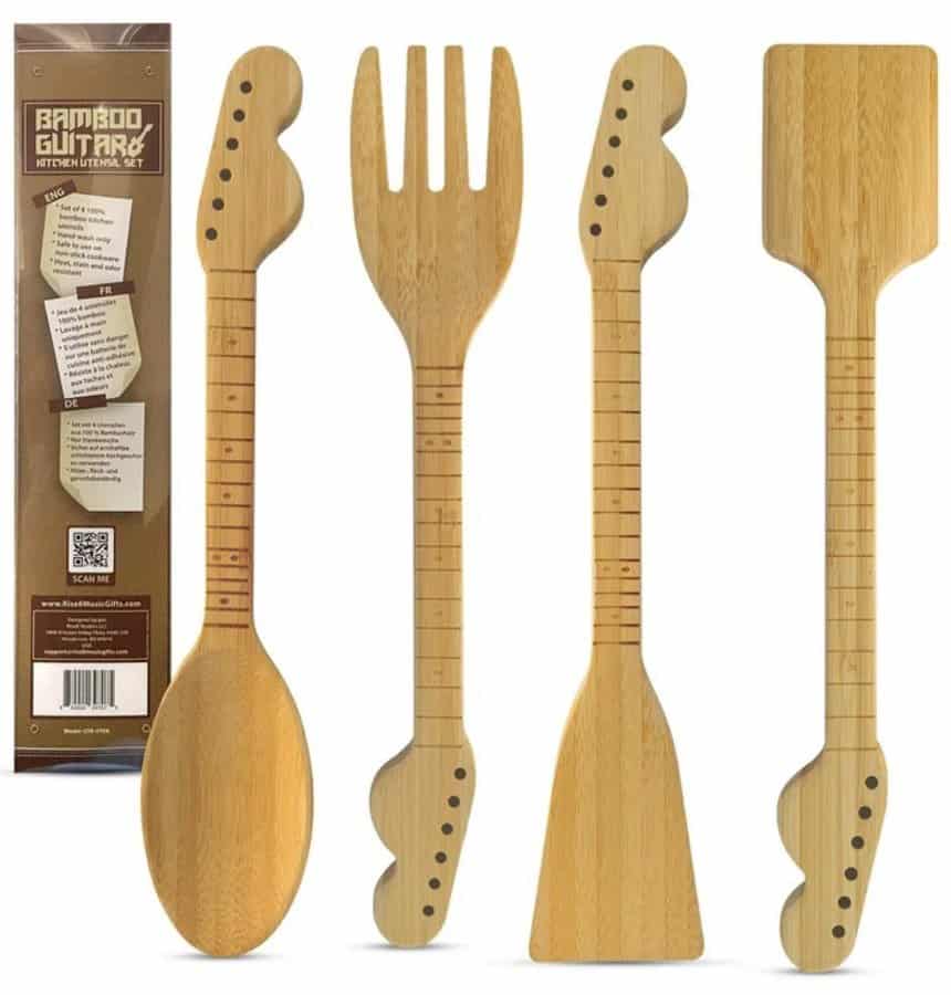 A set of bamboo kitchen utensils, including a spoon, fork, and spatula, where the handles have been meticulously carved and burned to resemble the fretboards and headstocks of Fender electric guitars.