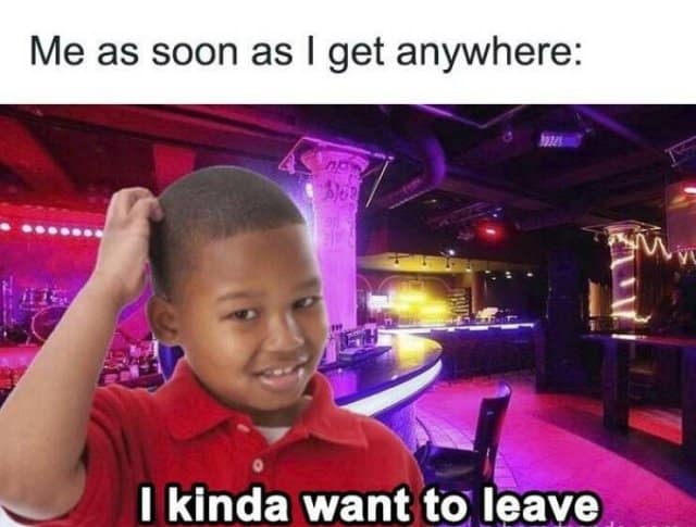 An introvert-themed classic meme featuring a young boy with a skeptical expression scratching his head. He is photoshopped into a crowded, neon-lit nightclub with the caption: "Me as soon as I get anywhere: I kinda want to leave."