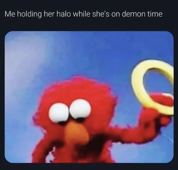 Elmo holding a golden halo captioned "Me holding her halo while she's on demon time"