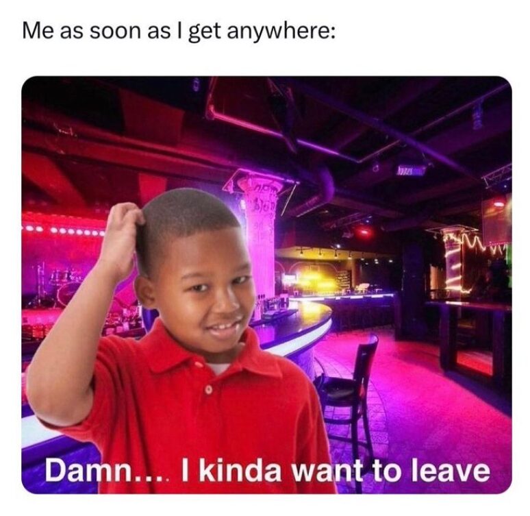 relatable funny introvert meme featuring a young boy in a red polo shirt scratching his head with a confused expression, photoshopped into a vibrant, neon-lit nightclub. The caption reads: "Me as soon as I get anywhere: Damn... I kinda want to leave."