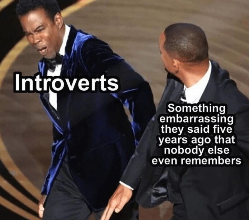 An introvert meme using the iconic Will Smith and Chris Rock Oscars slap. Will Smith is labeled "Something embarrassing they said five years ago that nobody else even remembers," while Chris Rock is labeled "Introverts," capturing the sudden sting of social anxiety.