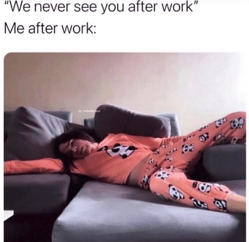 A "recharging" introvert meme showing a woman in pink panda-print pajamas splayed out horizontally across multiple couch cushions in a state of total exhaustion. The caption contrasts a coworker saying "We never see you after work" with "Me after work."