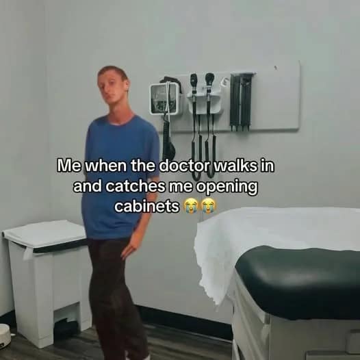 A funny meme from a meme dump showing a lanky man standing awkwardly in a clinical medical exam room. The overlaid text reads: "Me when the doctor walks in and catches me opening cabinets 😭😭."