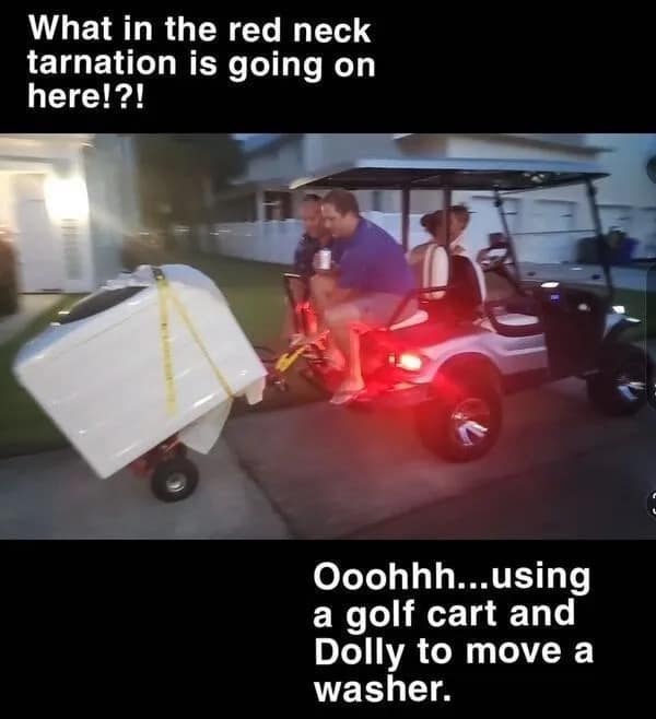 masterclass in improvised moving: a silver golf cart towing a heavy white washing machine balanced precariously on a two-wheeled hand dolly, secured with bright yellow ratcheting straps.