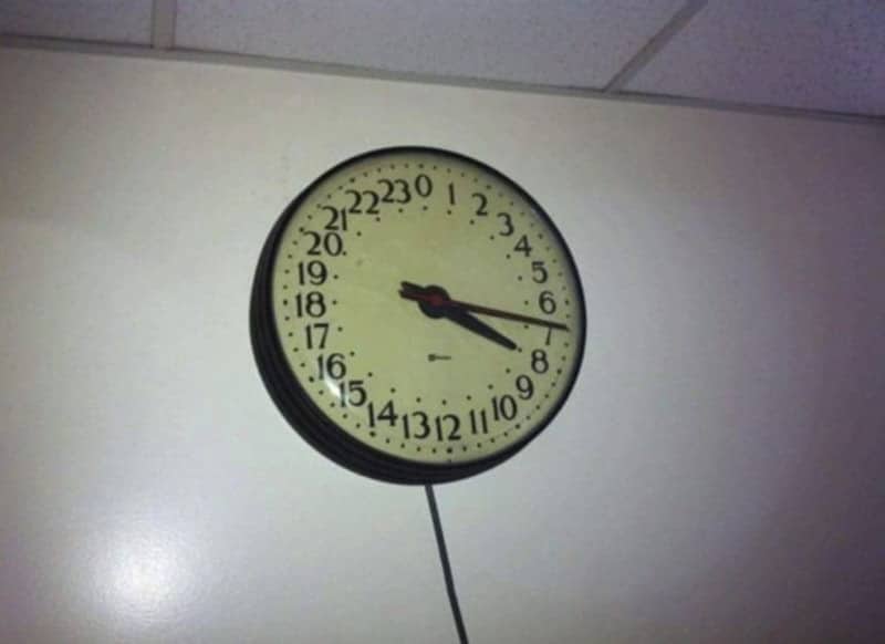 Wall-mounted 24-hour analog clock numbered 0 to 23 instead of 1 to 12