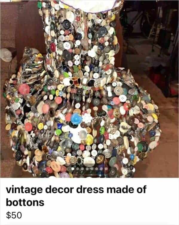 A marketplace listing for a weird fashion "vintage decor dress" for $50. The entire garment is constructed from a chaotic, dense armor of thousands of mismatched, multi-colored buttons.