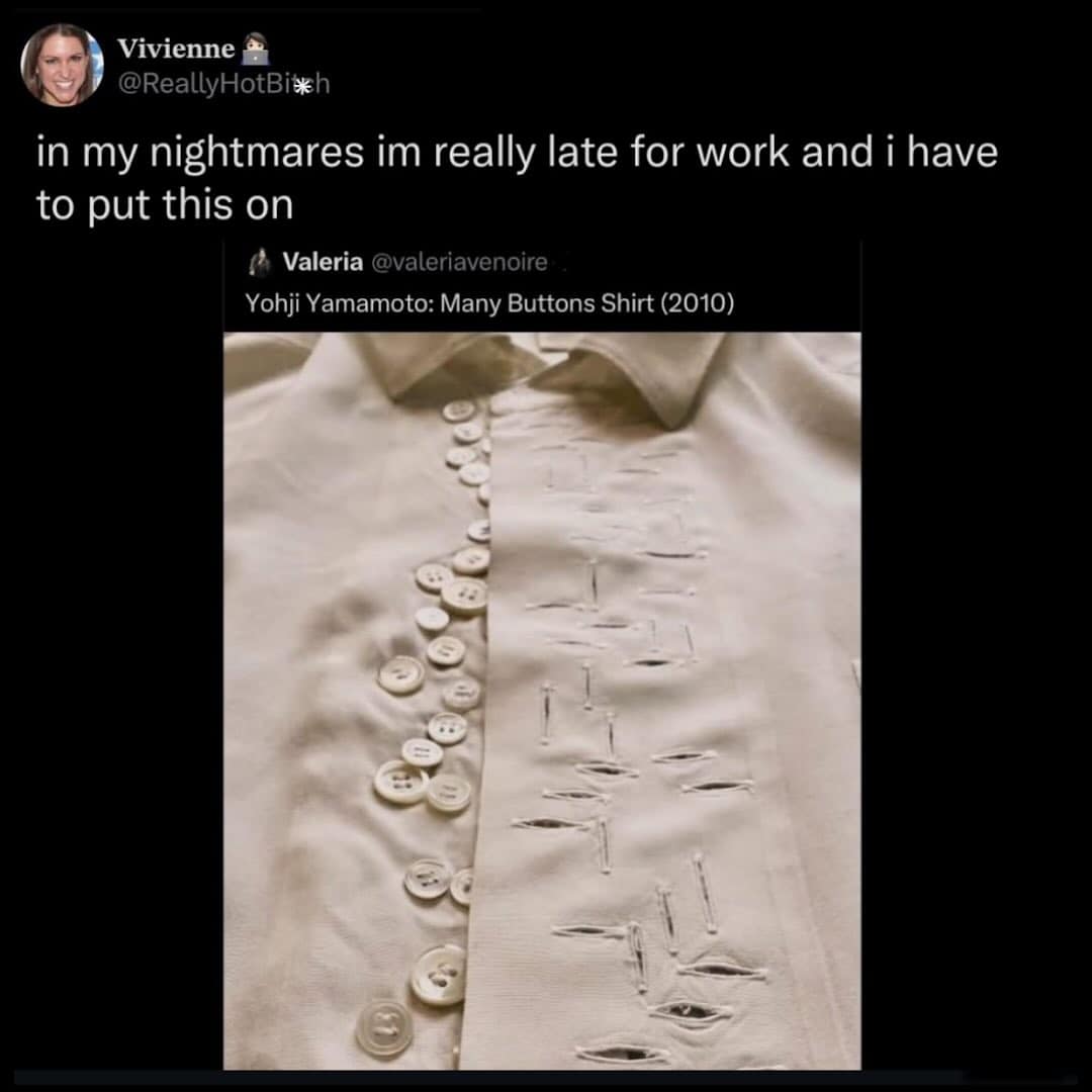 A close-up of a weird fashion nightmare: the Yohji Yamamoto "Many Buttons Shirt" from 2010. The white dress shirt is covered in dozens of irregularly placed buttons and a corresponding mess of buttonholes.