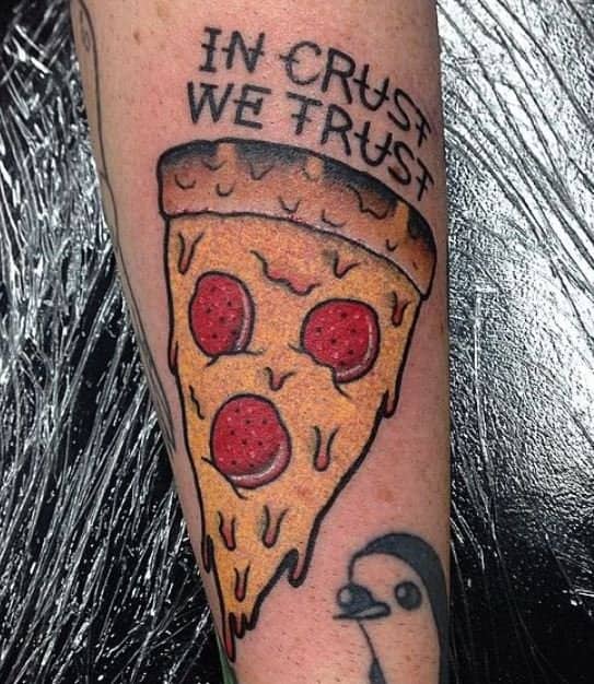Pepperoni pizza slice tattoo accompanied by the phrase in crust we trust funny tattoos.
