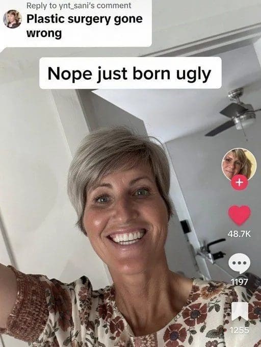 Smiling woman answering a plastic surgery comment on TikTok with a self-deprecating joke.