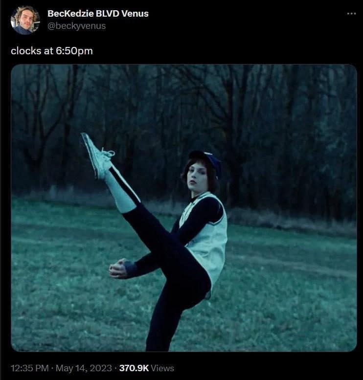 Twilight's Alice winding up a baseball pitch in a field, captioned clocks at 6:50pm.