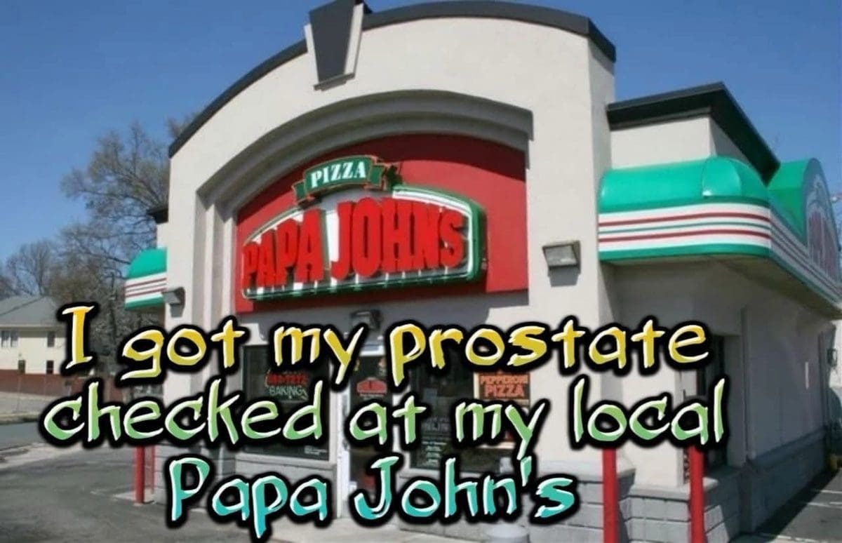 Papa John's pizza restaurant storefront with a joke about getting a prostate exam there.