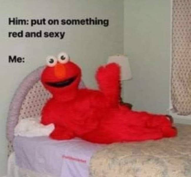 Elmo costume lounging on a bed in a meme about putting on something red