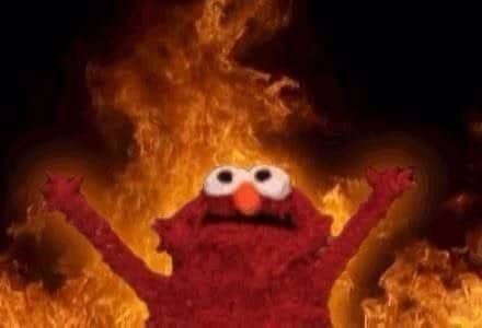 Elmo raising both arms while surrounded by flames in the classic Elmo fire meme