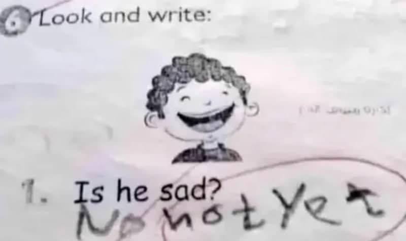 Is he sad worksheet showing a smiling boy, answered with not yet.