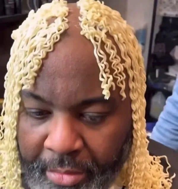 A man wearing curly instant ramen noodles as hair, opening today's meme dump.