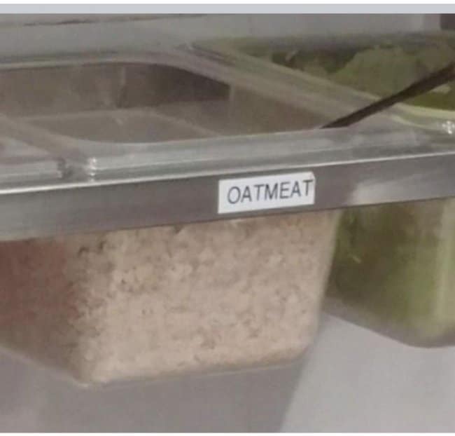 Bulk bin of grains labeled OATMEAT, one of the heartiest spelling fails here.
