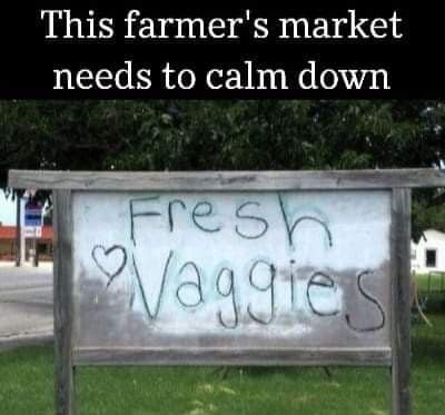 Farmer's market sign painted Fresh Vaggies with a heart instead of veggies.
